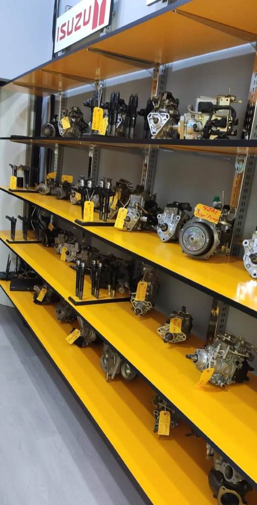 Shelves of genuine diesel injector pumps in stock